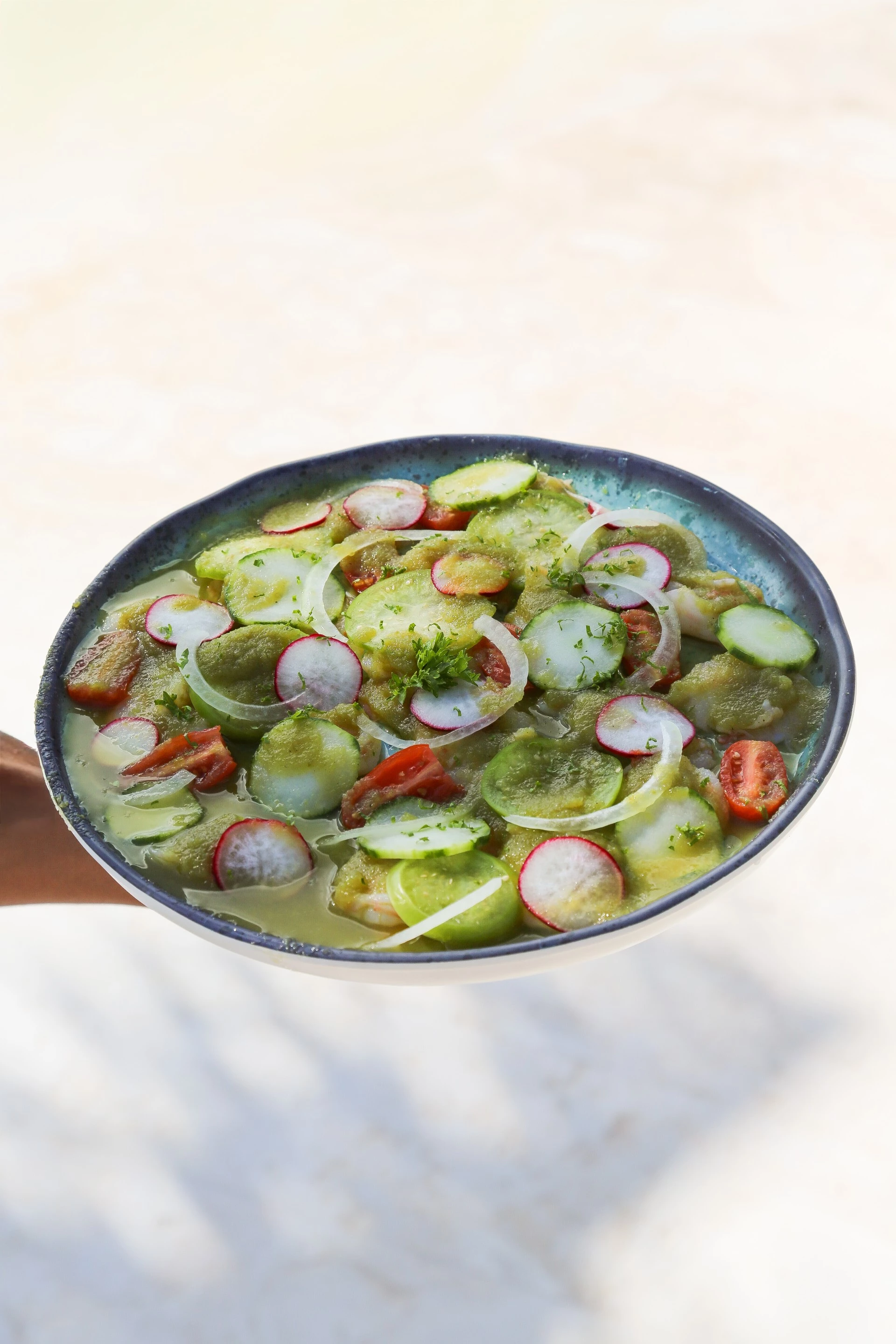 a bowl of food with vegetables