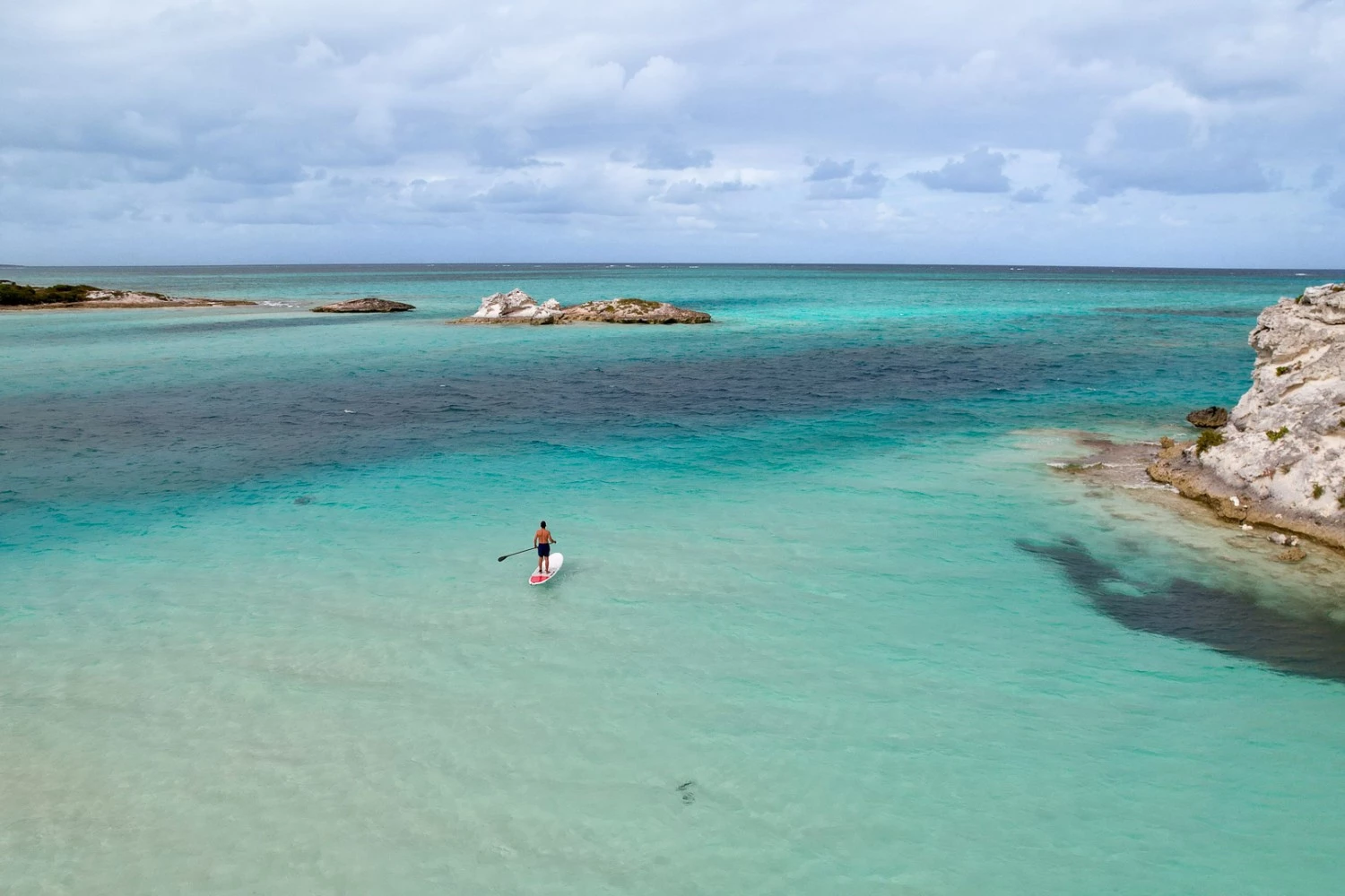 a person on a surfboard in the water