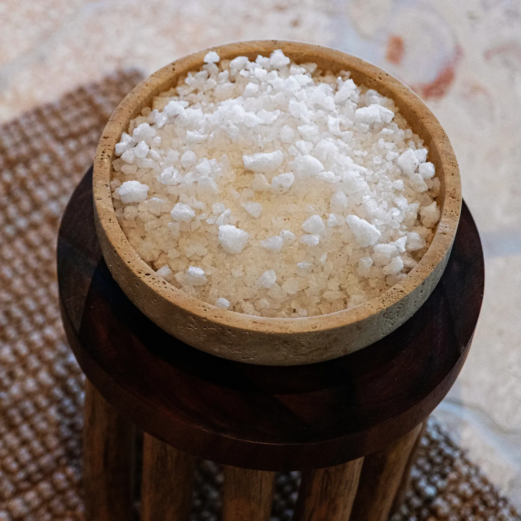 a bowl of salt on a stand