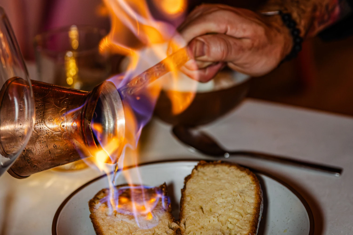 a person lighting up food on a plate