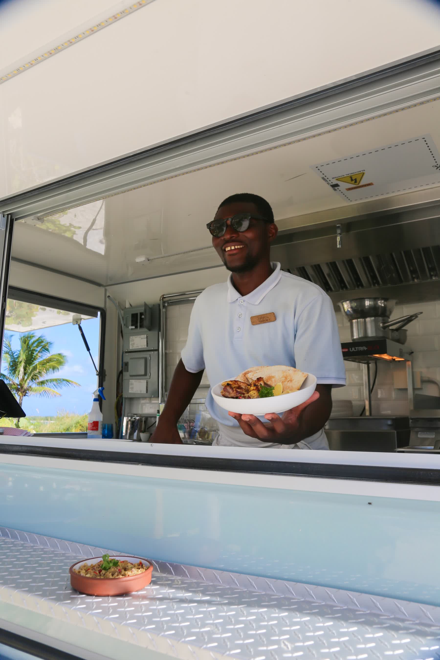 a man holding a plate of food
