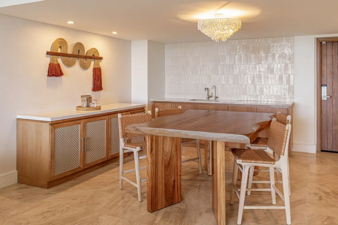 a kitchen with a table and chairs