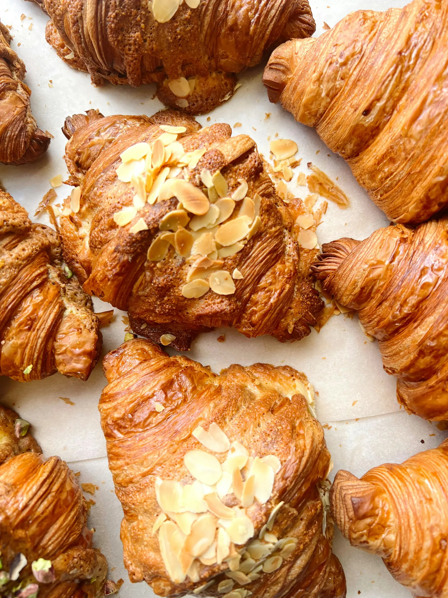a group of croissants with almonds