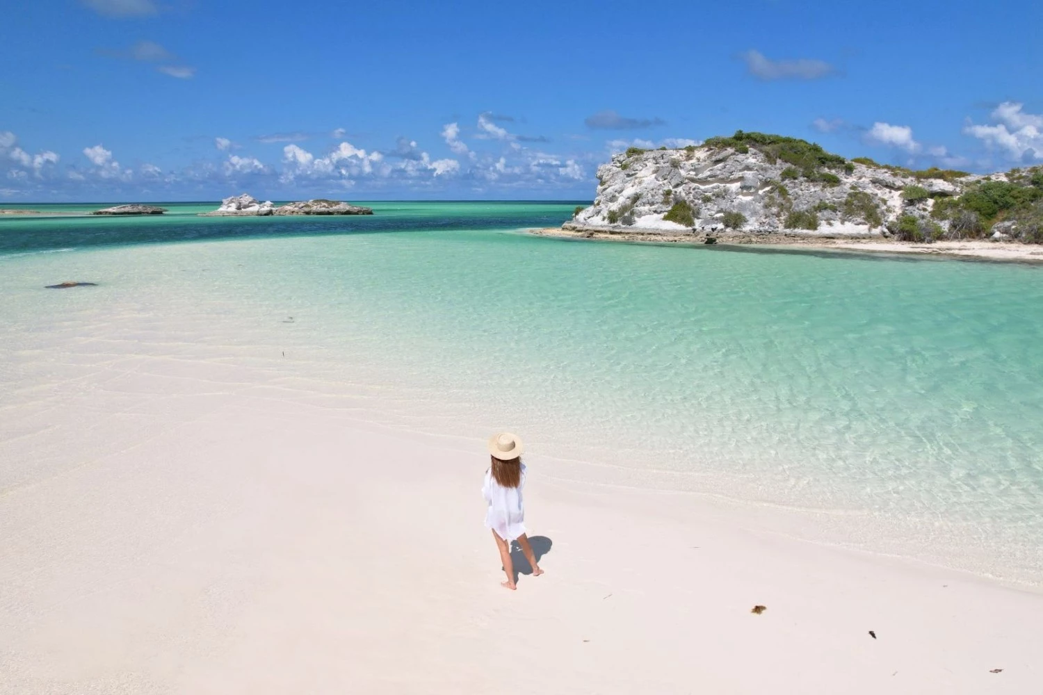 a woman walking on a beach