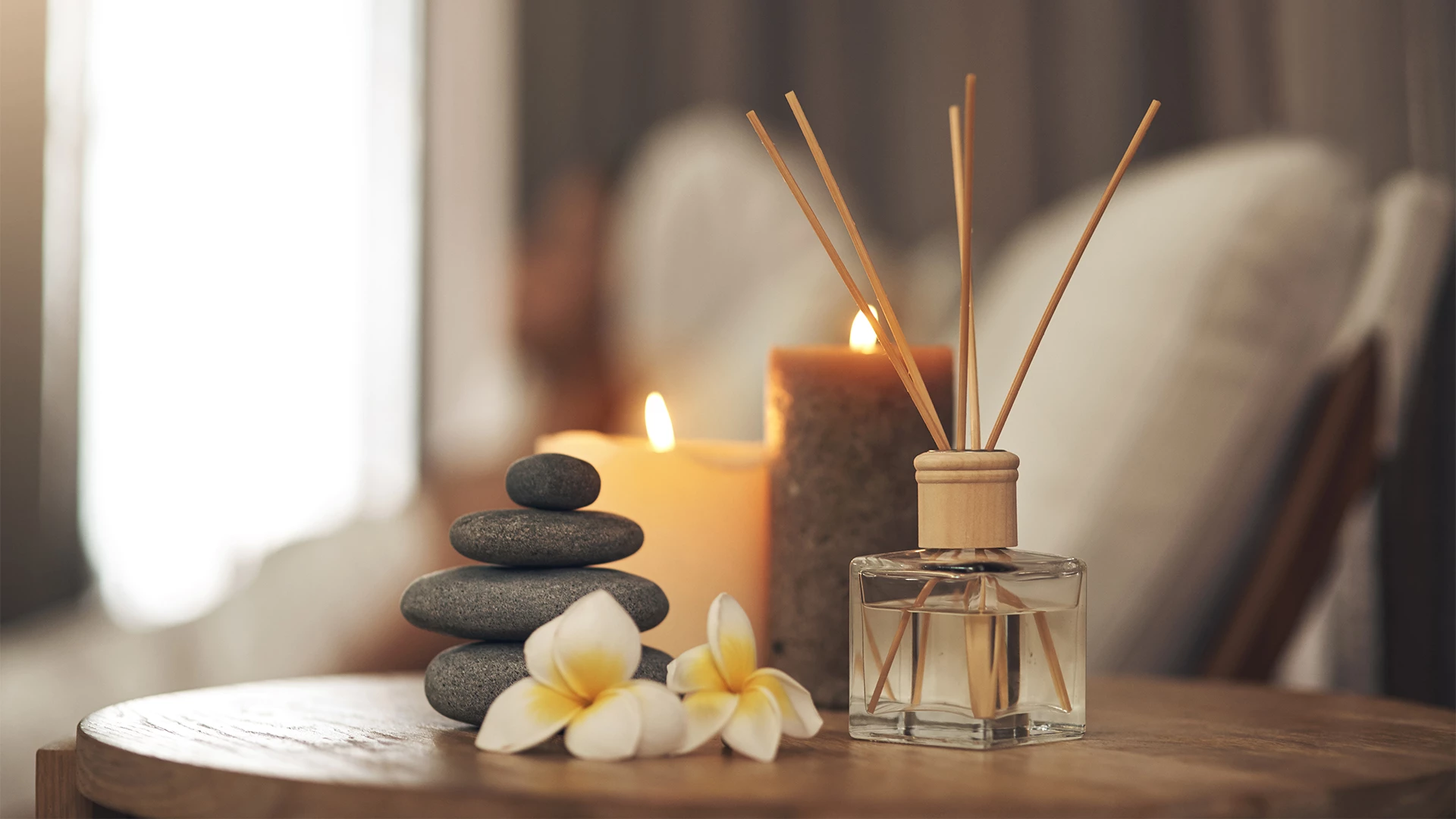 a candle and a bottle of air freshener