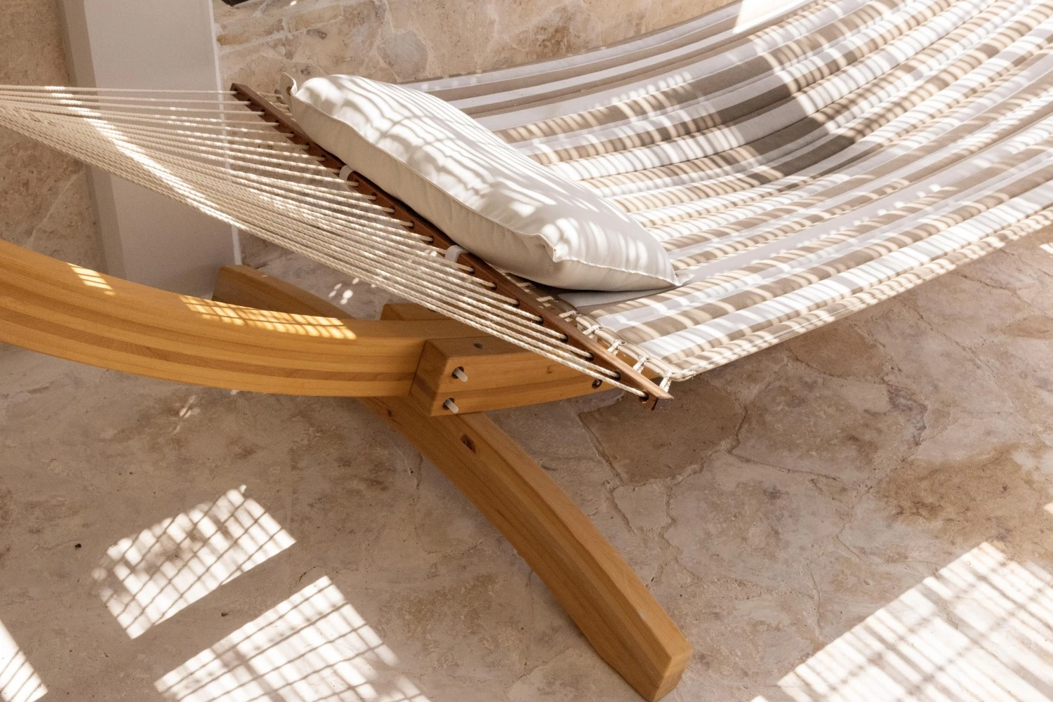a hammock with a pillow on it