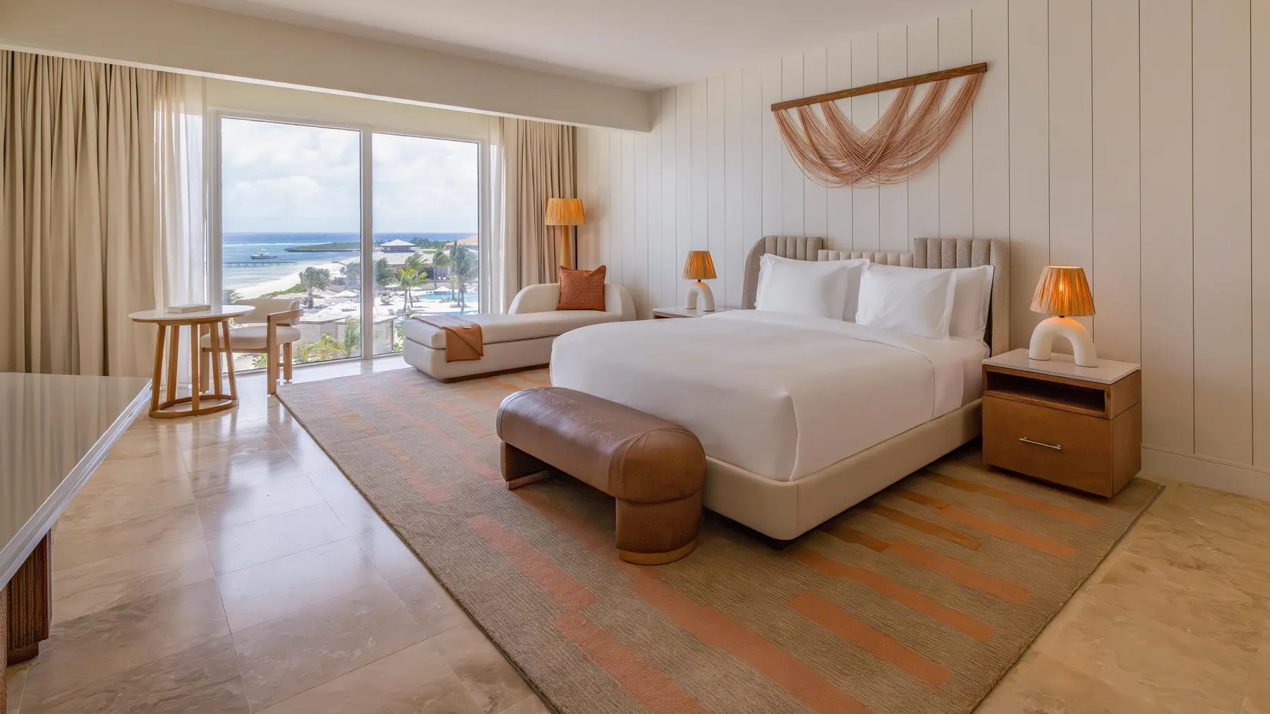 a bedroom with a large bed and a large window