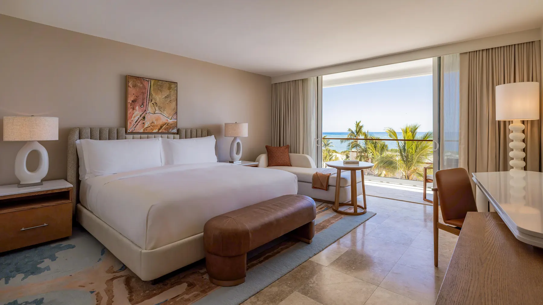 a guestroom with a bed and a table and chairs