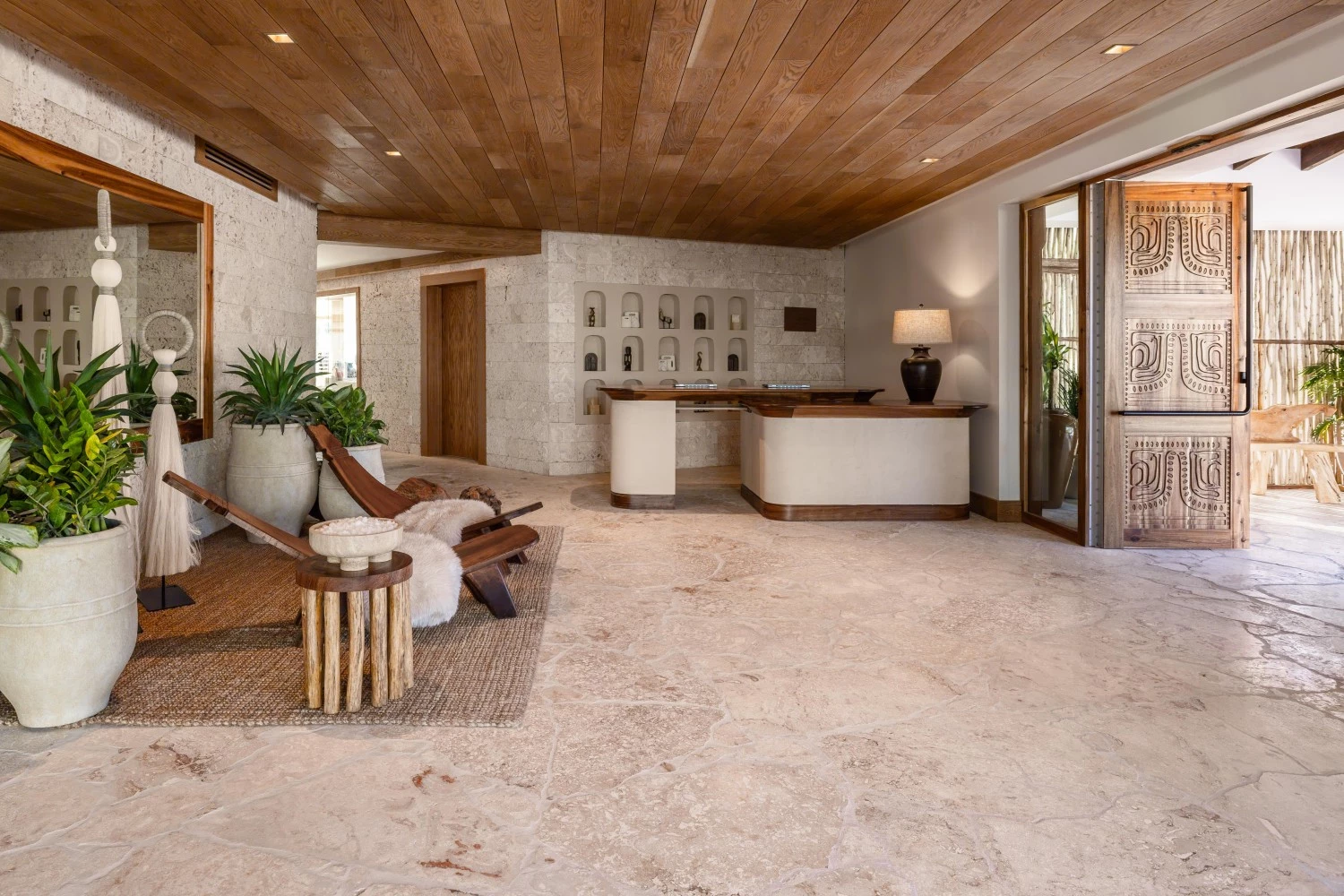 a room with a reception desk and chairs