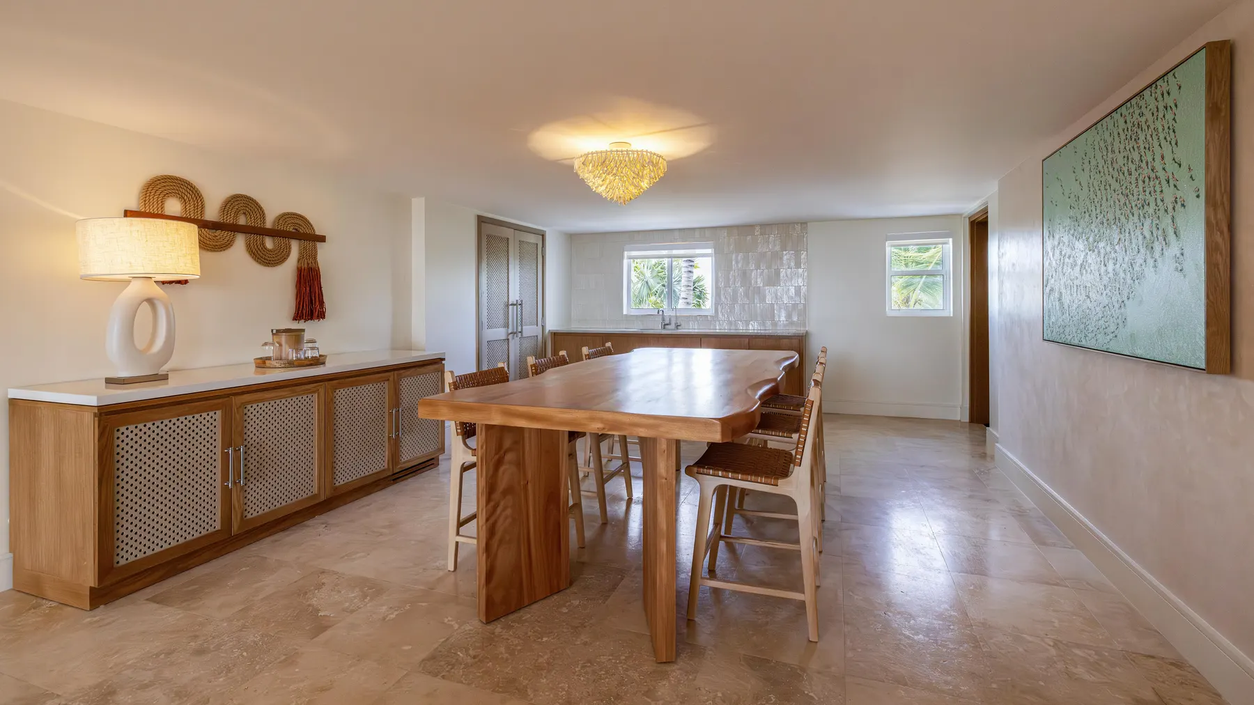 a dining room with a table and chairs