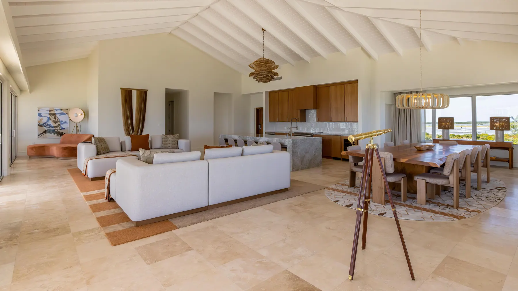 a living room with a large table and chairs