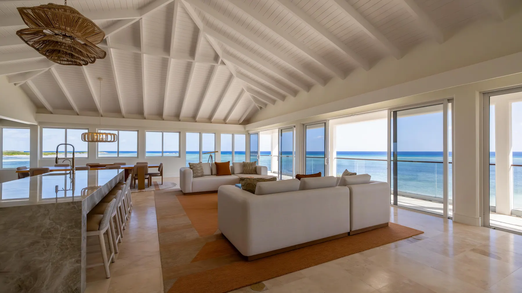 a living room with a view of the ocean